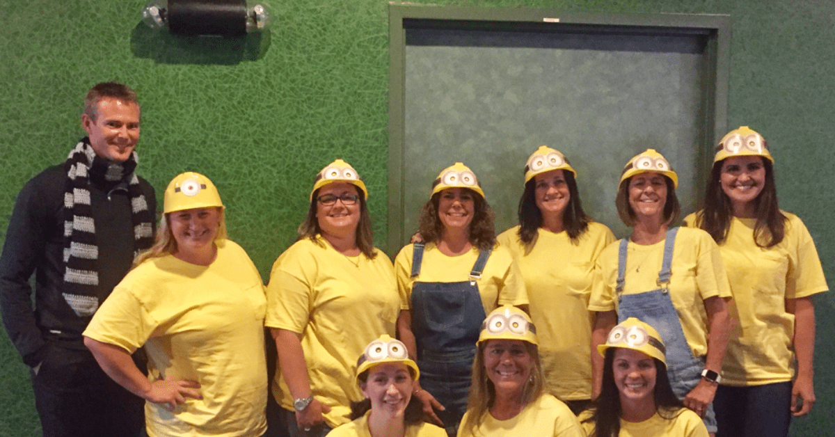 Dr. Caudill and their team posing for a photo dressed as minions