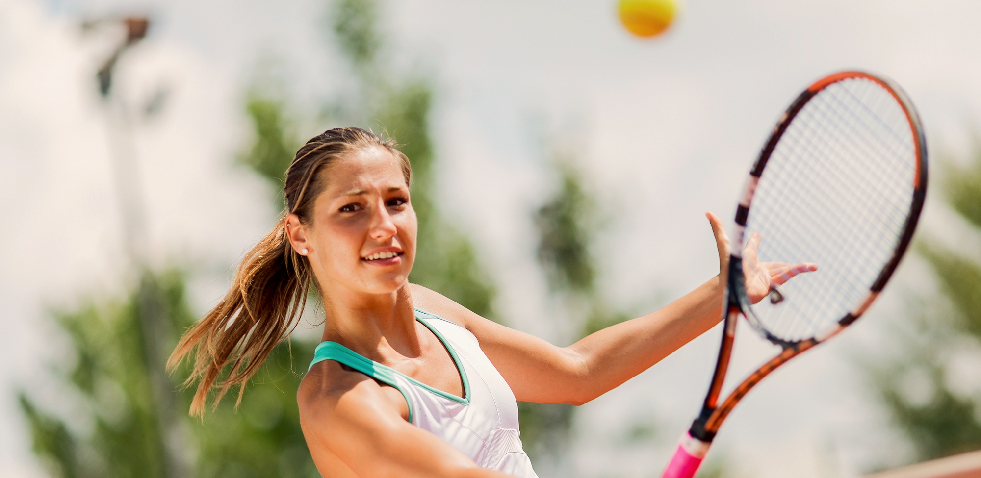 young woman playing tennis