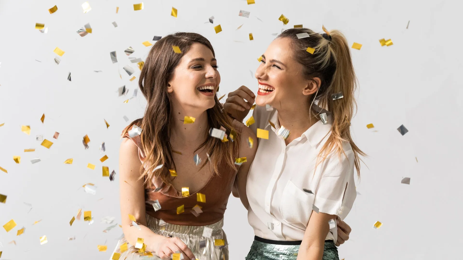 adults celebrate with confetti all the reasons to get braces or Invisalign in the new year