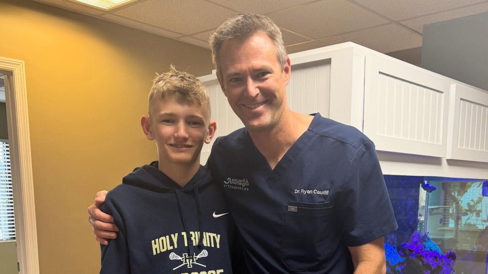 orthodontist and patient celebrating National Facial Protection Month