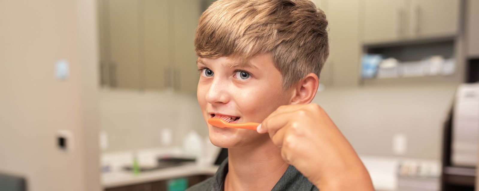 boy learns about orthodontics and oral health